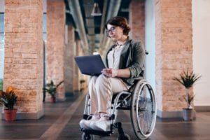 Lady with computer in Wheel Chair