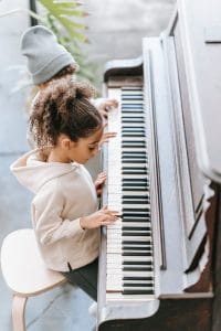 Little Girl Plays Piano
